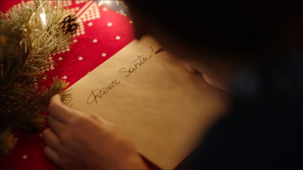 Hand-writing of Dear Santa on the Parchment Letter Paper on Christmas Eve