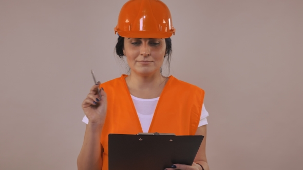 Female Worker Writing Document