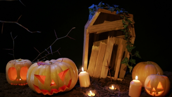 Halloween Cemetery , Candles and Jack-o-lantern