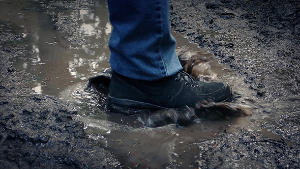 Foot Splashes Muddy Puddle