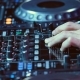 DJ Plays Mix on Controller at a Disco - VideoHive Item for Sale