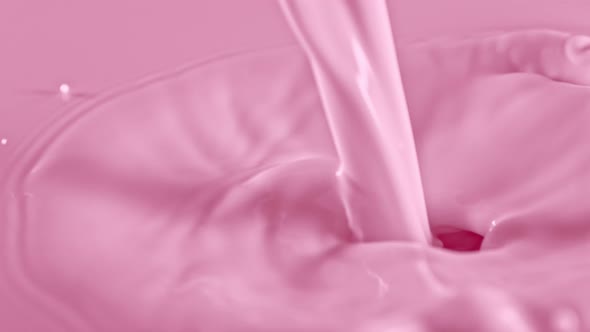 Super Slow Motion Shot of Pouring and Splashing Strawberry Milk at 1000Fps