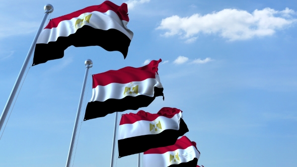 Multiple Waving Flags of Egypt Against the Blue Sky alt