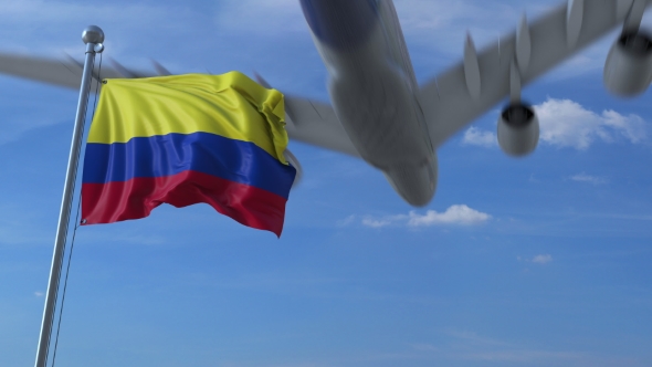 Airplane Flying Over Waving Flag of Colombia