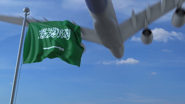 Airplane Flying Over Waving Flag of Saudi Arabia