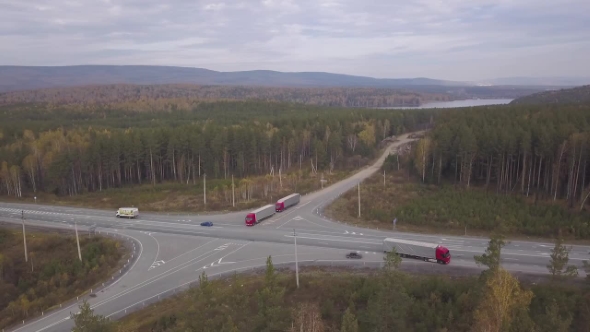 Drone View Truck Car with Freight Container Across Road Junction on Highway