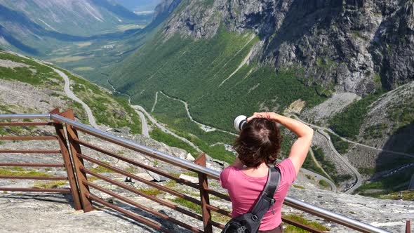 Tourist With Camera On Trollstigen Viewpoint