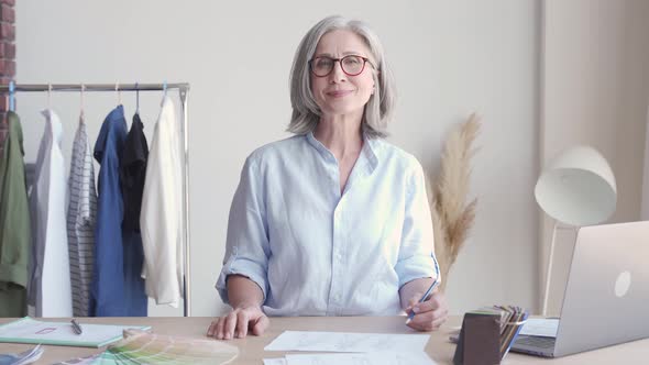 Happy Middle Aged Stylish Woman Fashion Designer at Workplace Portrait