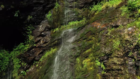 Clean Small Waterfall in the Forest. Beautiful Nature Norway Natural Landscape.