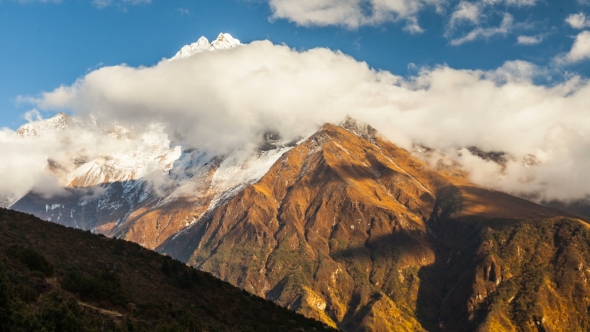 . The Movement of Clouds Near the Majestic Mount Kangtega. Himalayas. Sagarmatha National Park