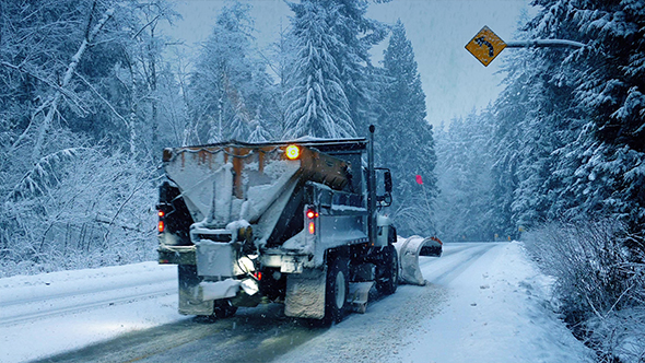 Truck With Snowplow And Cars Drive Past