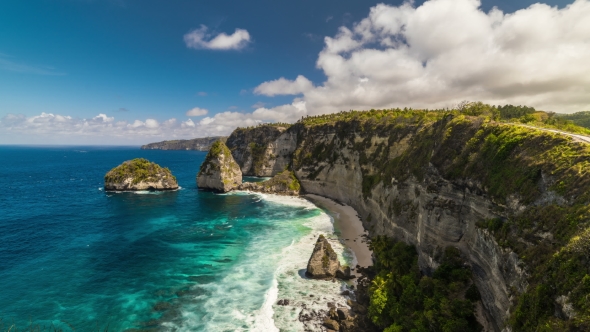 Rocky Coast with Big Waves and Clouds at Nusa Penida Island, Indonesia