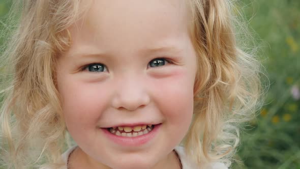 Portrait of a Little Girl Looking in the Camera