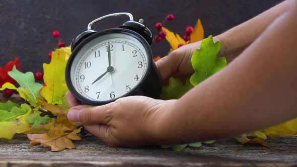 Autumn Time  Someones Hands Changing Time One Hour Back on Alarm Clock Slow Motion