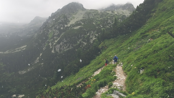 Group of Tourists Trekking in High Tatra Mountains