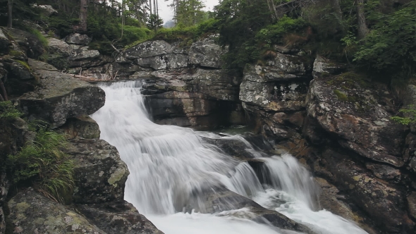 Mountain River with Cascade Waterfall in Forest