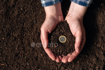g extra income, female farmer handful of soil with euro coin