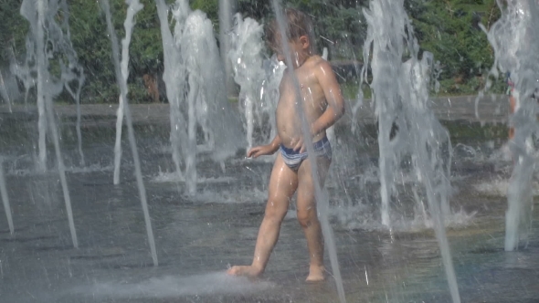 The Boy Is Playing in the Fountain