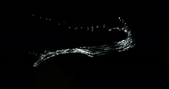 Water spurting out against Black Background, Slow motion 4K