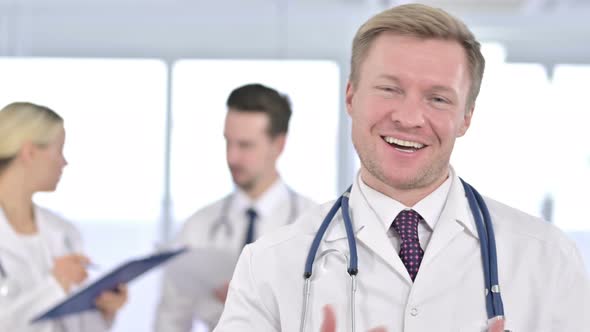 Portrait of Attractive Male Doctor Doing Video Chat