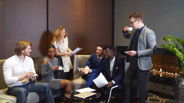 Confident Group Of Young Professionals In A Meeting.