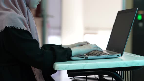 Female Hands are Typing on Keyboard