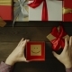 Top Down Shot of Adult Man Opening Christmas Present Box with Sticky Note with Smile Inside - VideoHive Item for Sale