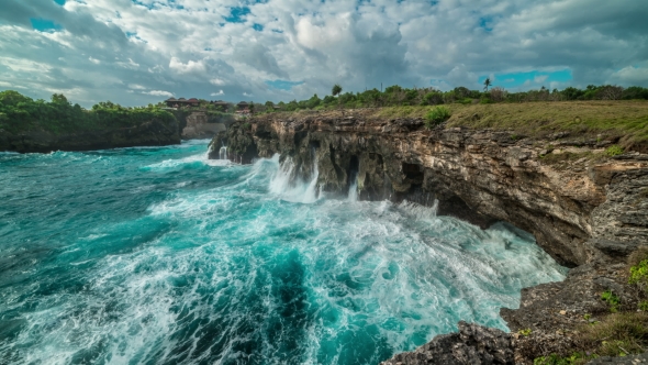 Huge Waves Break About the Rocks on the Island Nusa Ceningan, Indonesia