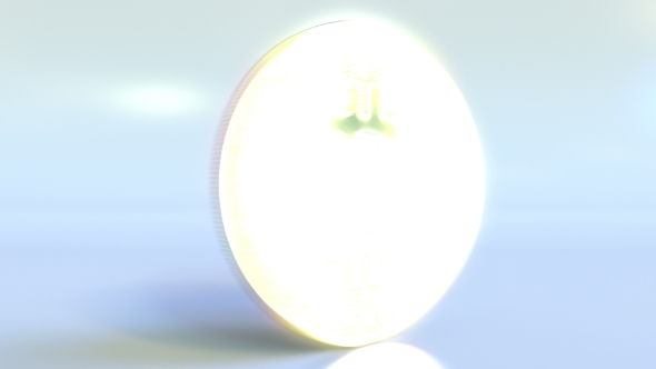 Realistic Shiny Bitcoin Token Spins Across the Frame and Stops alt