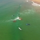 Group Surfing Lesson on Costa Caparica Beautiful Ocean Beach, Portugal. Aerial View - VideoHive Item for Sale