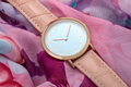 Wrist watch on colourful silk fabric background - PhotoDune Item for Sale