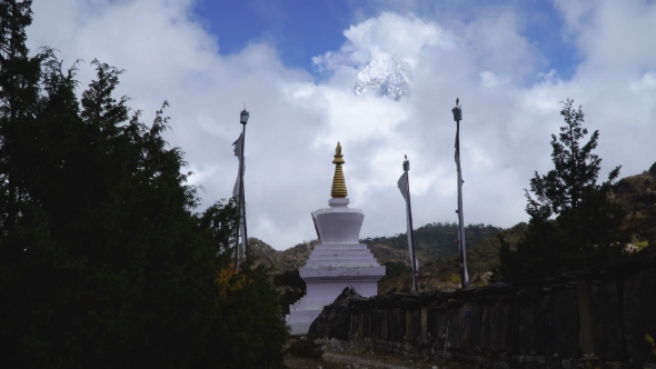 Buddhist Stupa and Snow Mountain