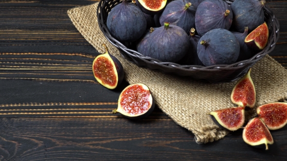 Fresh and Dried Fig Isolated on Wooden Background