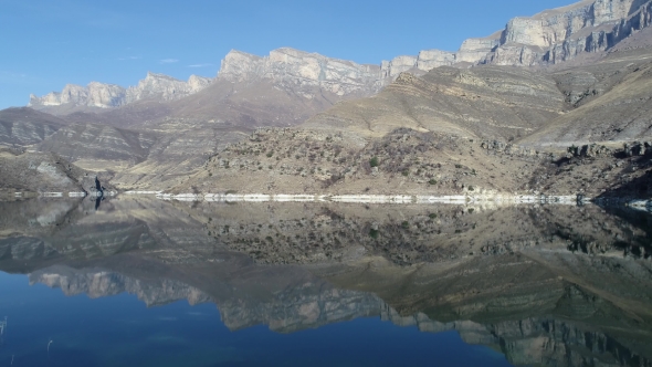 Reflection of Rocks in a Mountain Lake