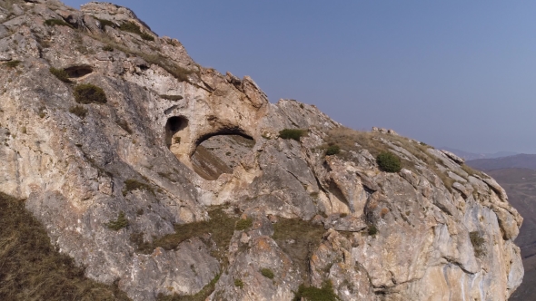 Flying Around a Rock with a Hole