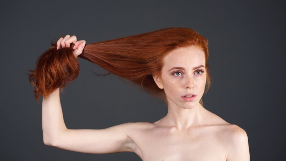 Beauty Portrait of Woman Face with the Red Hair