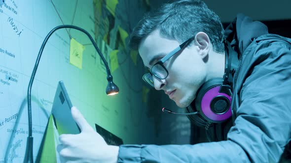 Young Caucasian Man Looking at Laptop Screen