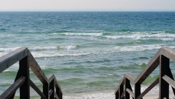 Beautiful Landscape of the Stairs to the Windy Sea Beach with Curly Waves  60p