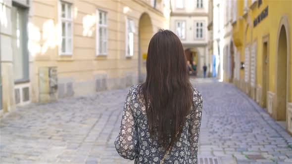 Woman Walking in City. Young Attractive Tourist Outdoors in Italian City