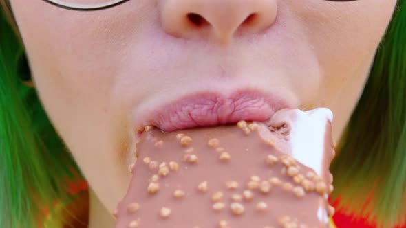 A Young Woman Eats an Ice Cream