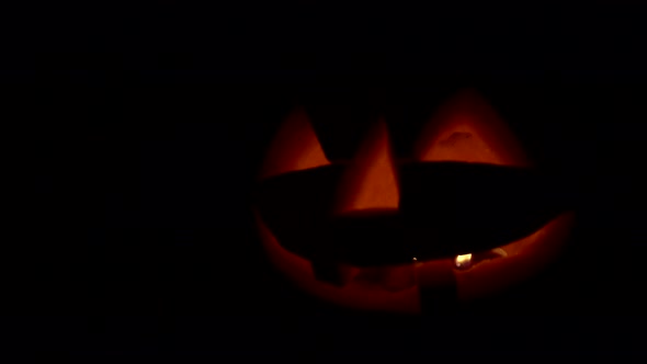 Isolated Pumpkin Lantern with Smoke and Burning Candle Inside