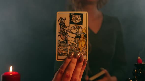 A Fortune Teller Showing a Death on a Horse Tarot Card