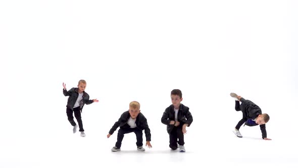 Kids Are Dancing a Modern Dance on the White Background in Black Leather Jackets and Jeans. Slow