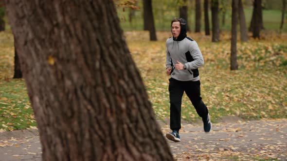 Man Jogging in a Park