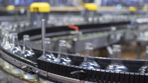 Glass Bottles Being Sorted in a Conveyer