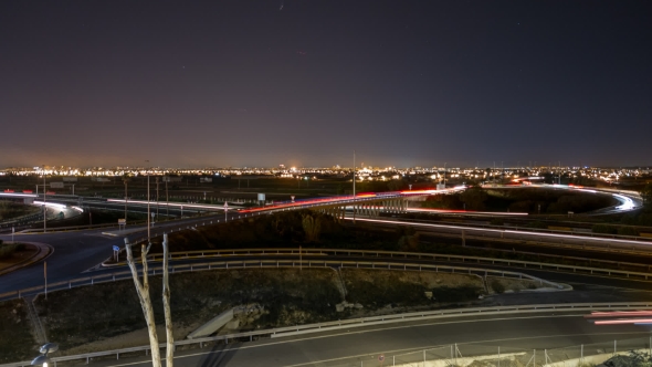 Busy Light Trail Traffic, City Skyline and Stars