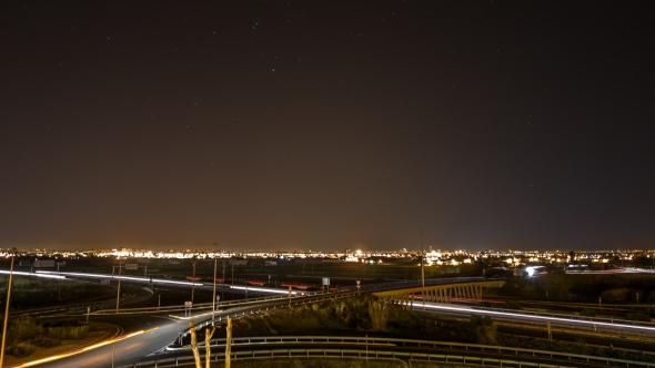 Car Trails, City Skyline and Stars