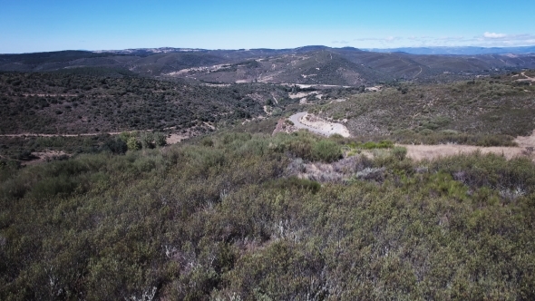 Elevating Camera Over Curved Mountain Road