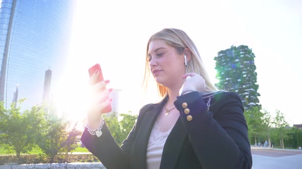 Slow motion shot of businesswoman using smartphone for video call