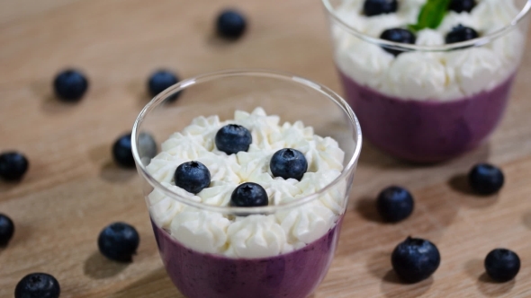 Decorate with Mint Leaves Blueberry Panna Cotta in a Glass